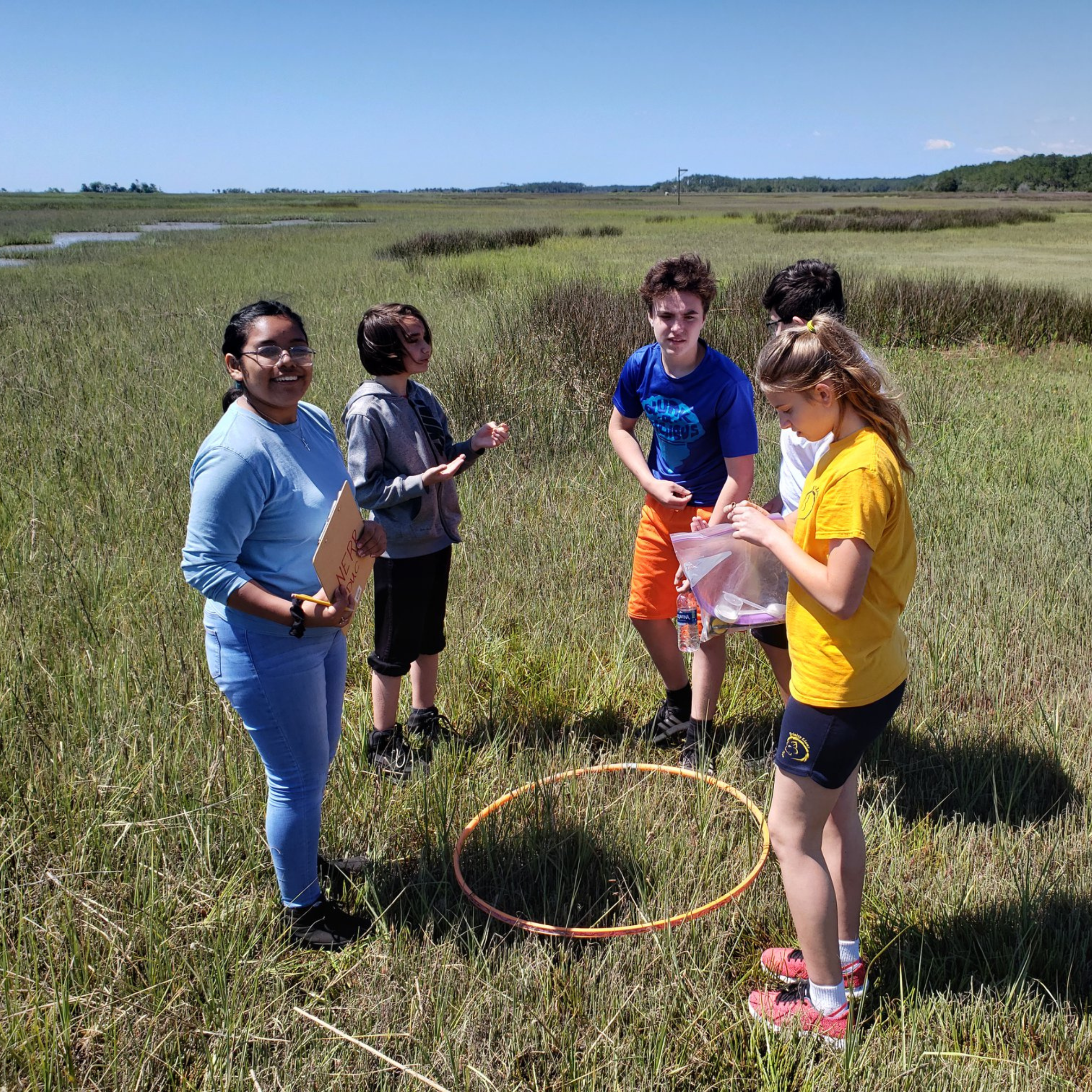 GSS_3 Group of students in a salt marsh collecting data for a project.