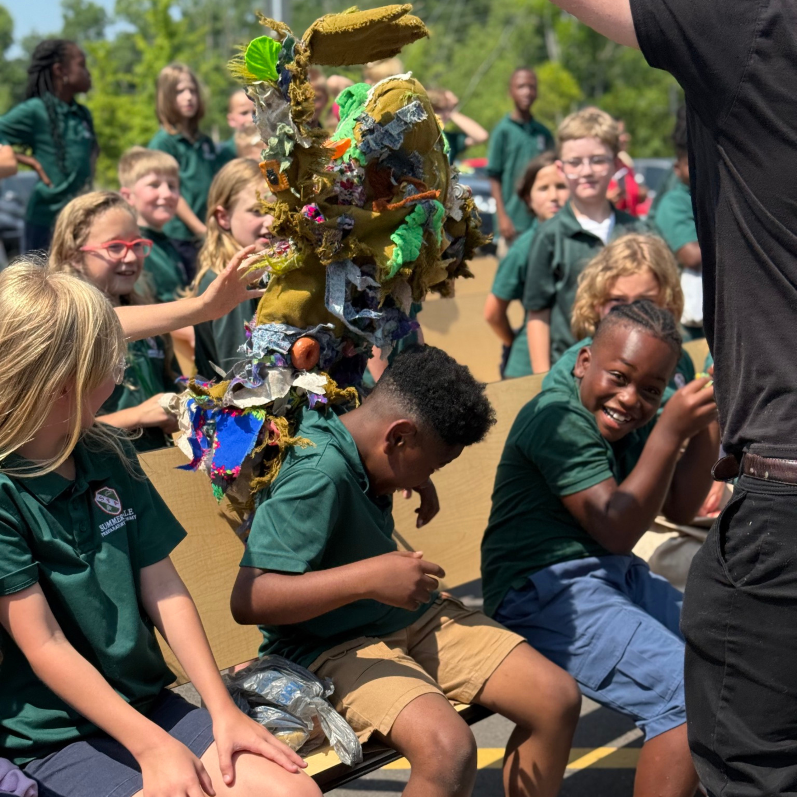 Learn Group of school children as audience members of PalmettoPride's Litter Trashes Everyone Marionette Show.